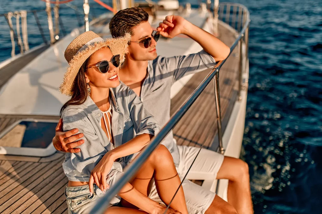 A couple enjoying a sunset onboard a yacht rental in Fort Lauderdale, Florida in the open ocean waves