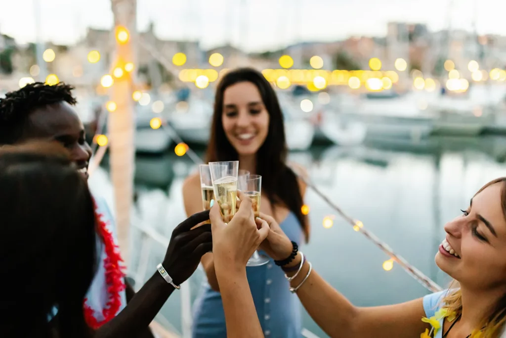 A group of friends toasting a celebration on a chartered yacht rental.